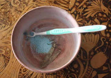 Silver jewelry cleaning with detergent and brush tooth