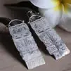 Aretes con la fecha completa de la Cuenta Larga maya