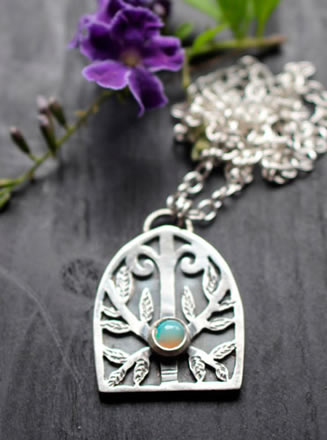 Guardian of the forest pendant, carrying within it the power of the gods of war and hunting