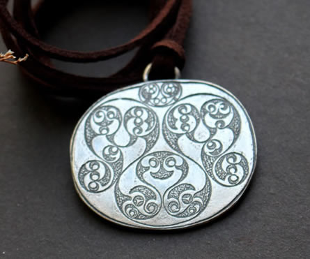 the Desborough Mirror necklace, crafted from the back of the famous English Celtic mirror.