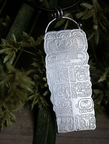 Maya Long Count pendant, using the glyphs of the Pre-Hispanic calculation system