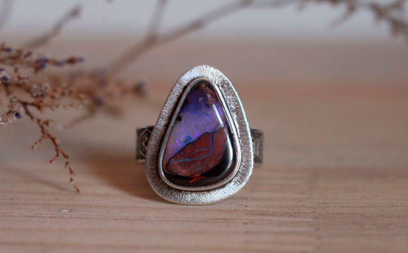 A world in balance, volcano ring in silver and boulder opal
