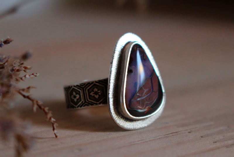 A world in balance, volcano ring in silver and boulder opal