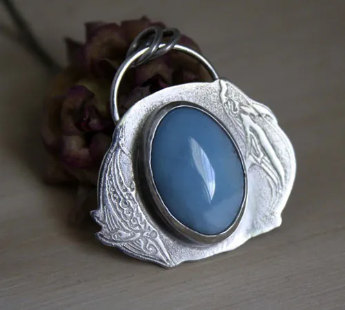 Ballet acuático, dije delfín y ballena en plata y larimar