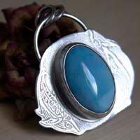 Ballet acuático, dije delfín y ballena en plata y larimar