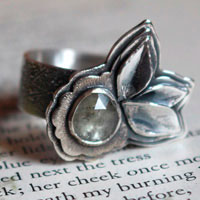 Blooming under the universe, flower and petals ring in silver and transparent sapphire