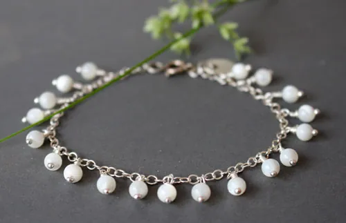 Cosmos, pulsera flor de la inocencia en plata y nácar
