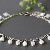 Cosmos, pulsera flor de la inocencia en plata y nácar