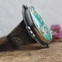 Dejarse llevar, anillo barco de origami en plata y turquesa de Nevada