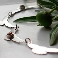 El canto del sol, collar aves en plata y zircón amarillo