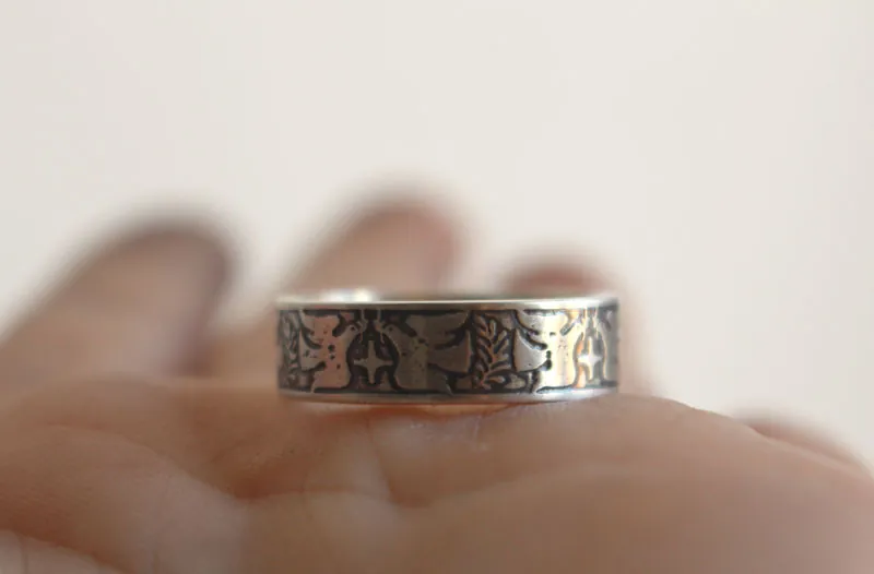 Esperanza y paz, anillo con paloma, estrella y rama de olivo en plata