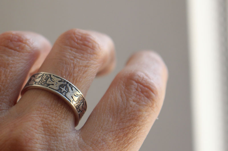 Esperanza y paz, anillo con paloma, estrella y rama de olivo en plata