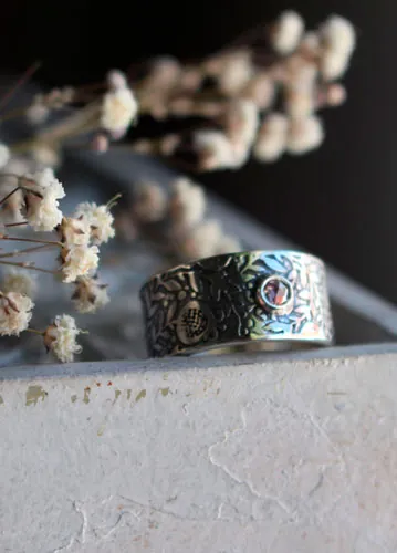 Eternidad, anillo granada en plata y diamante