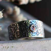 Eternidad, anillo granada en plata y diamante