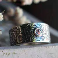 Eternidad, anillo granada en plata y diamante