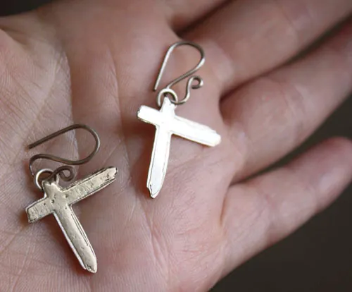 Indochine, aretes cruz Paradize del grupo de rock en plata