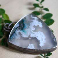 Land of ice, ice floe landscape pendant in silver and moss agate