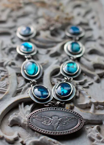 Lysandra, collar mariposa maorí en plata y paua