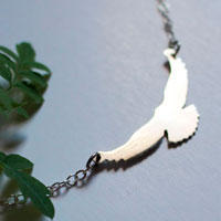 Message, bird symbol necklace in sterling silver
