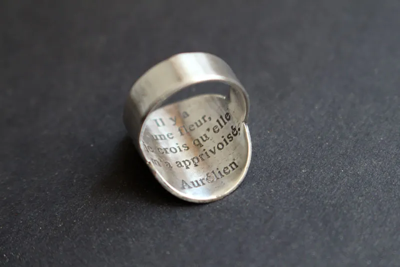 Pequeño planeta, anillo planeta del Principito con cita en plata