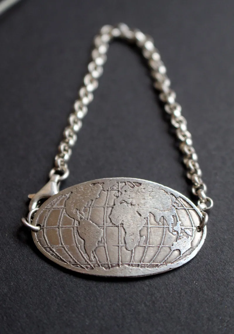 Raices, pulsera mapa del mundo en plata