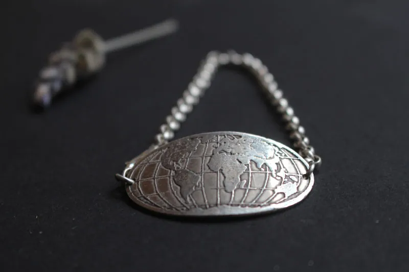 Raices, pulsera mapa del mundo en plata