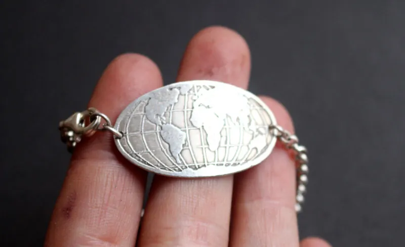 Raices, pulsera mapa del mundo en plata