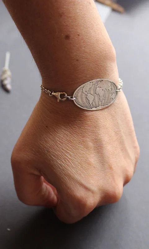 Raices, pulsera mapa del mundo en plata