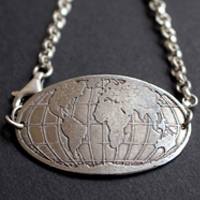 Raices, pulsera mapa del mundo en plata