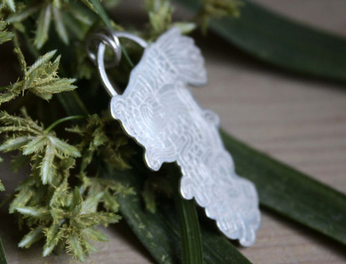 Serpiente emplumada, dije Quetzalcóatl dios azteca en plata