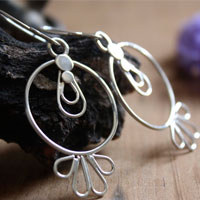 Sol tolteca, aretes prehispánicos en plata