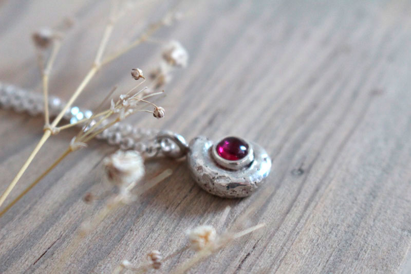 The cradle of life, nautilus ammonite and birthstone necklace in silver and ruby