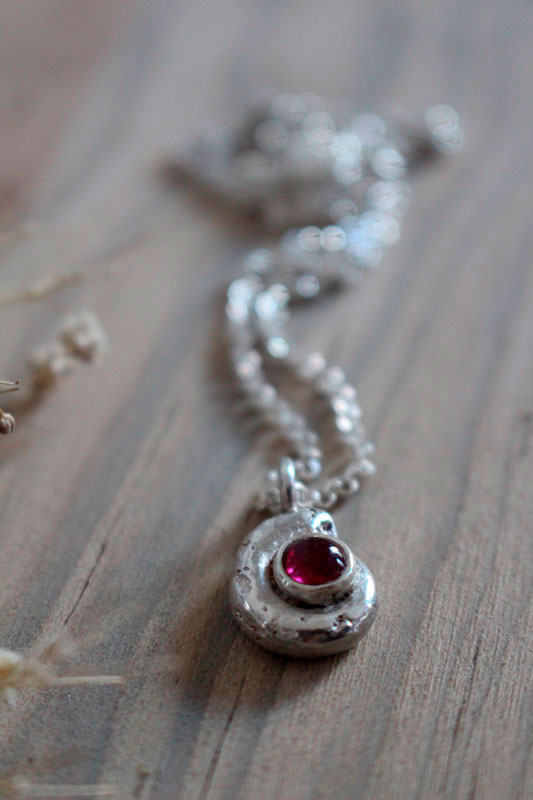 The cradle of life, nautilus ammonite and birthstone necklace in silver and ruby