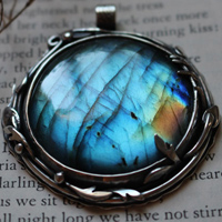 The reflection of the sky, leaves and branches pendant in silver and labradorite