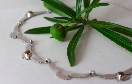 The song of the sun, bird necklace in silver and yellow zircon