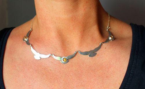 The song of the sun, bird necklace in silver and yellow zircon