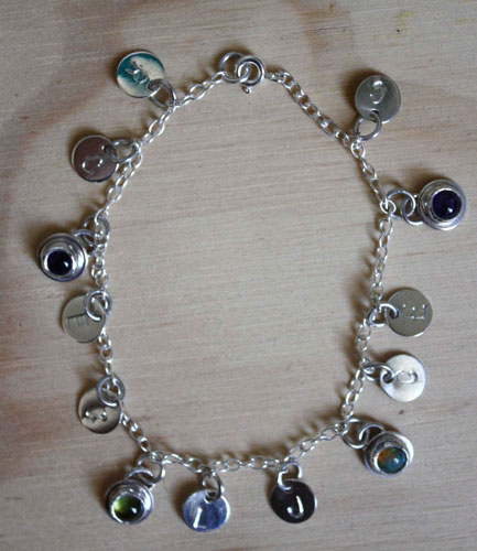 The tree of Jesse, family keepsake bracelet in silver, amethyst, opal, and peridot