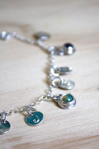 The tree of Jesse, family keepsake bracelet in silver, amethyst, opal, and peridot